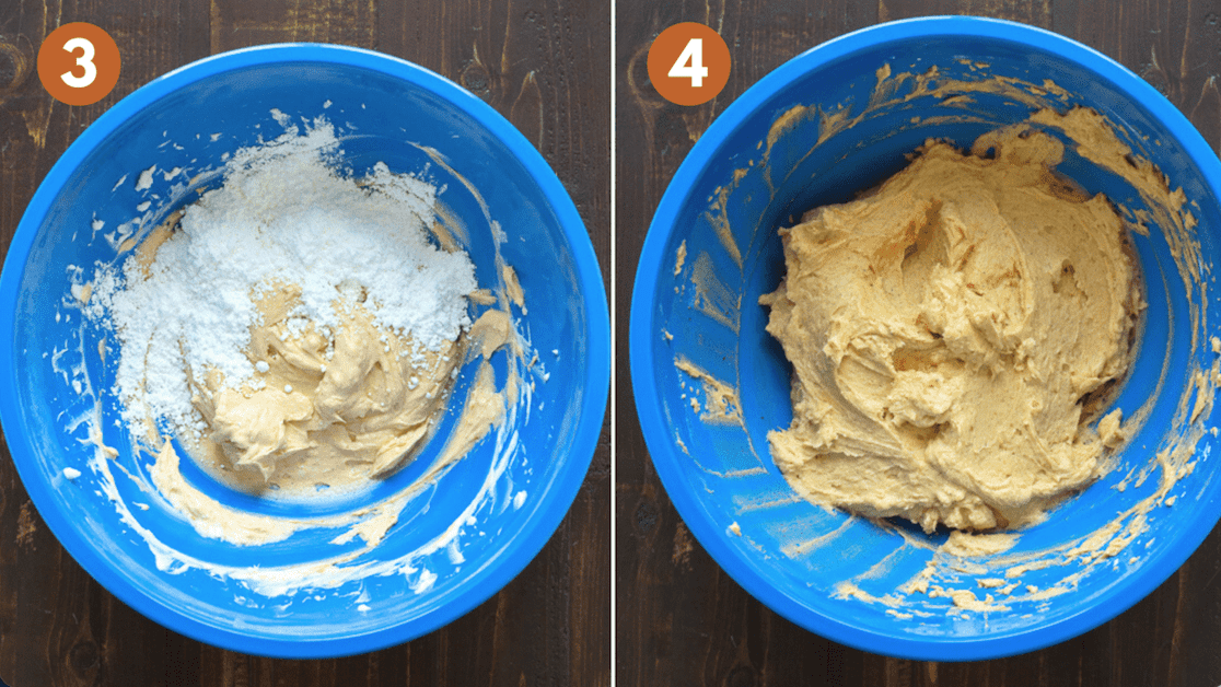 mixing pumpkin frosting in blue mixing bowl