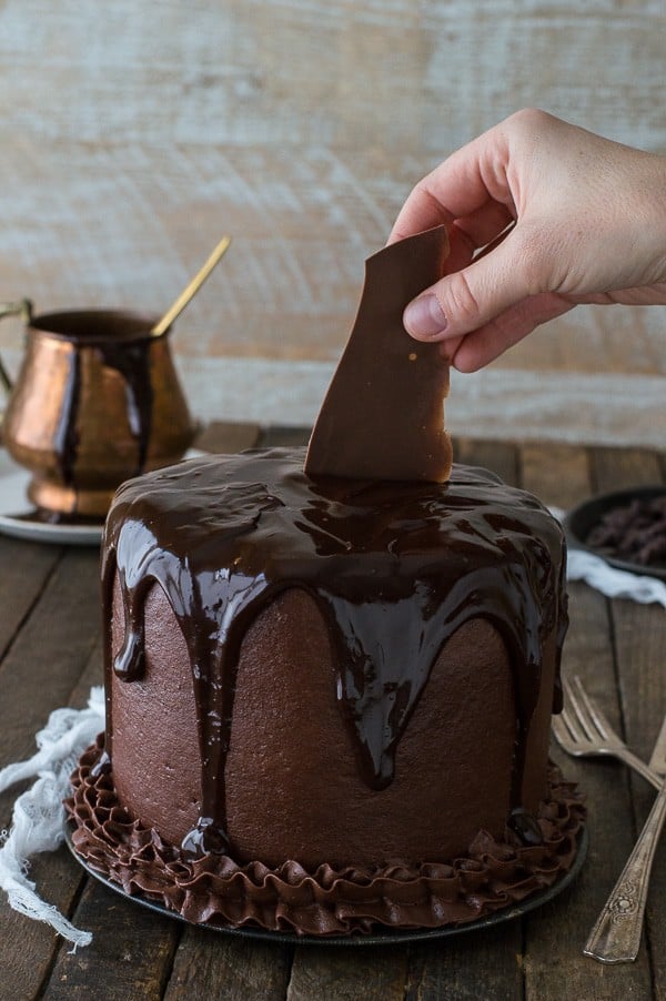 Putting a piece of chocolate shatter into the Chocolate Chocolate Cake.