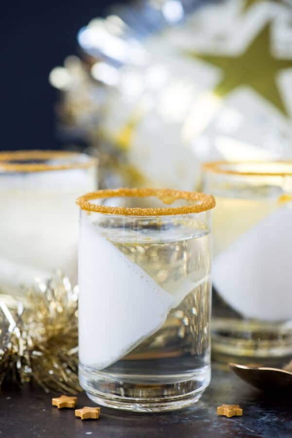 champagne jello cups in clear glass on dark background