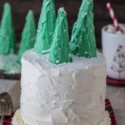 Easy gingerbread cake with vanilla bean buttercream, topped with snowy christmas trees!