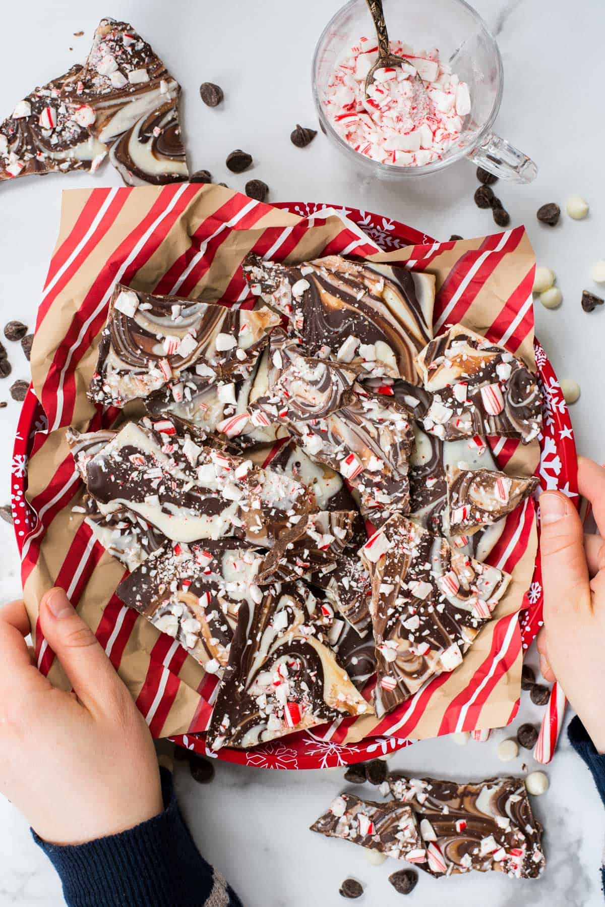 swirled chocolate and white chocolate peppermint bark on red tray