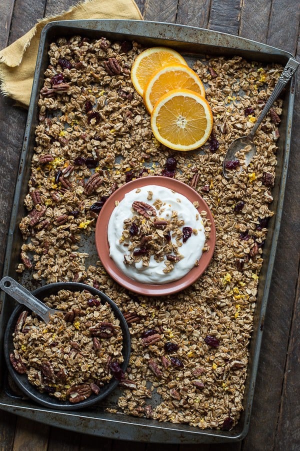 Homemade orange cranberry granola with orange zest, pecans, and dried cranberries! A soft granola that bakes in 8 minutes! 