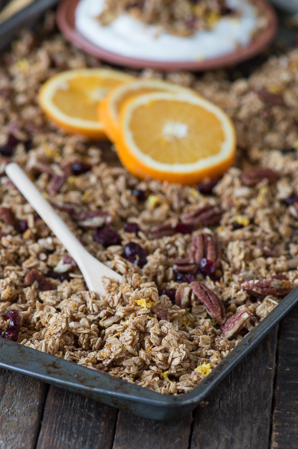 Homemade orange cranberry granola with orange zest, pecans, and dried cranberries! A soft granola that bakes in 8 minutes! 