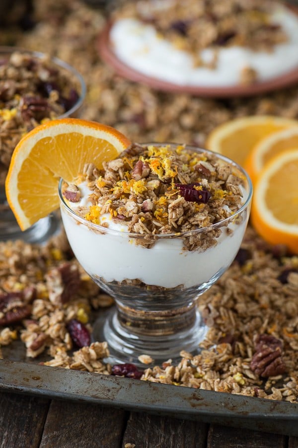 Homemade orange cranberry granola with orange zest, pecans, and dried cranberries! A soft granola that bakes in 8 minutes! 