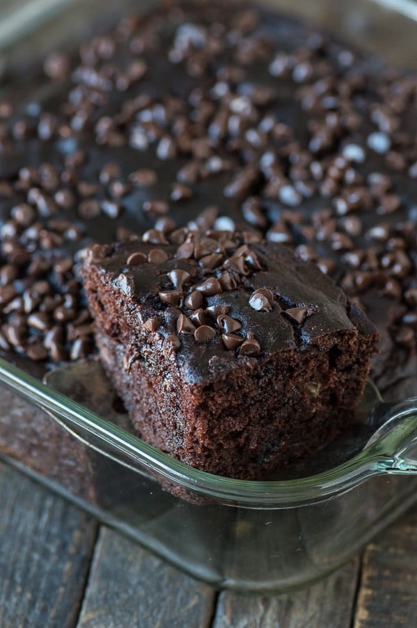 slice of healthier chocolate cake in glass pan