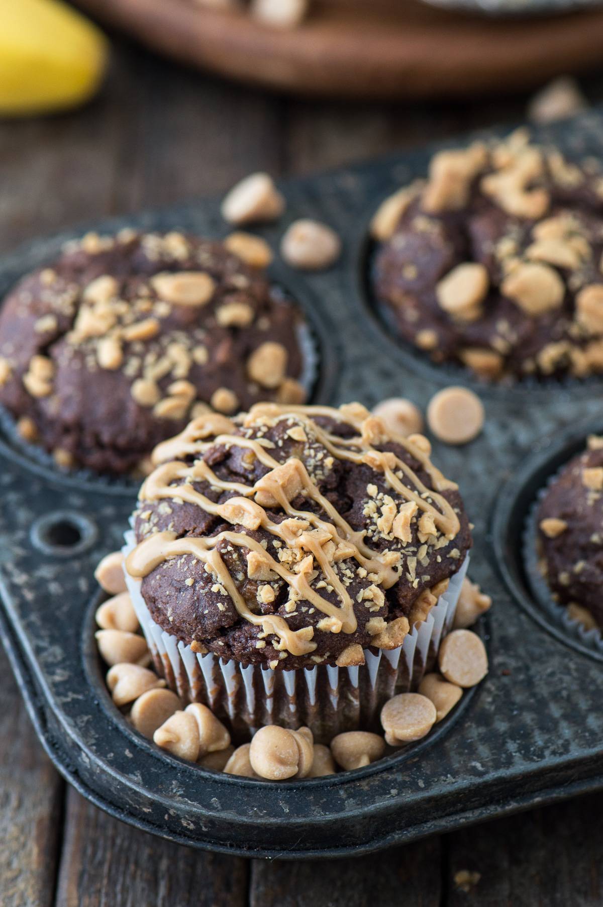 Healthy Chocolate Peanut Butter Chip Muffins made with greek yogurt, honey, and bananas!