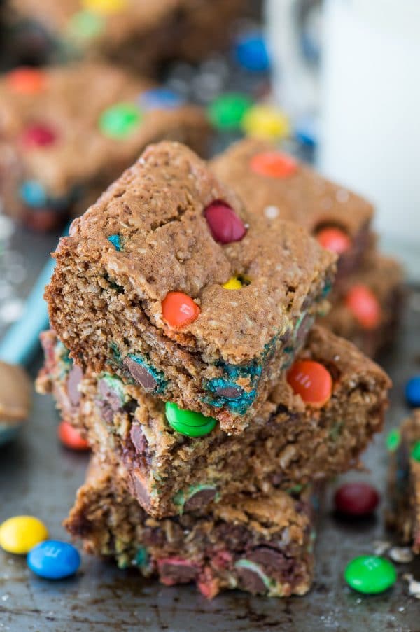 The BEST healthier monster cookie bars with no oil, butter, flour or sugar! Use coconut sugar or honey instead! Makes an 8x8 square pan so you don’t have too many around! 