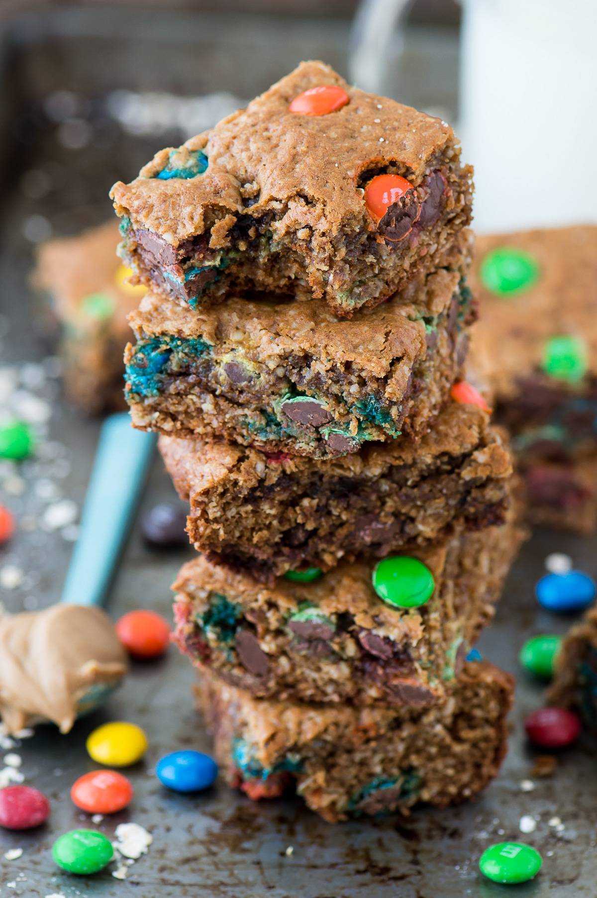 The BEST healthier monster cookie bars with no oil, butter, flour or sugar! Use coconut sugar or honey instead! Makes an 8x8 square pan so you don’t have too many around! 