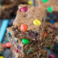 The BEST healthier monster cookie bars with no oil, butter, flour or sugar! Use coconut sugar or honey instead! Makes an 8x8 square pan so you don’t have too many around!