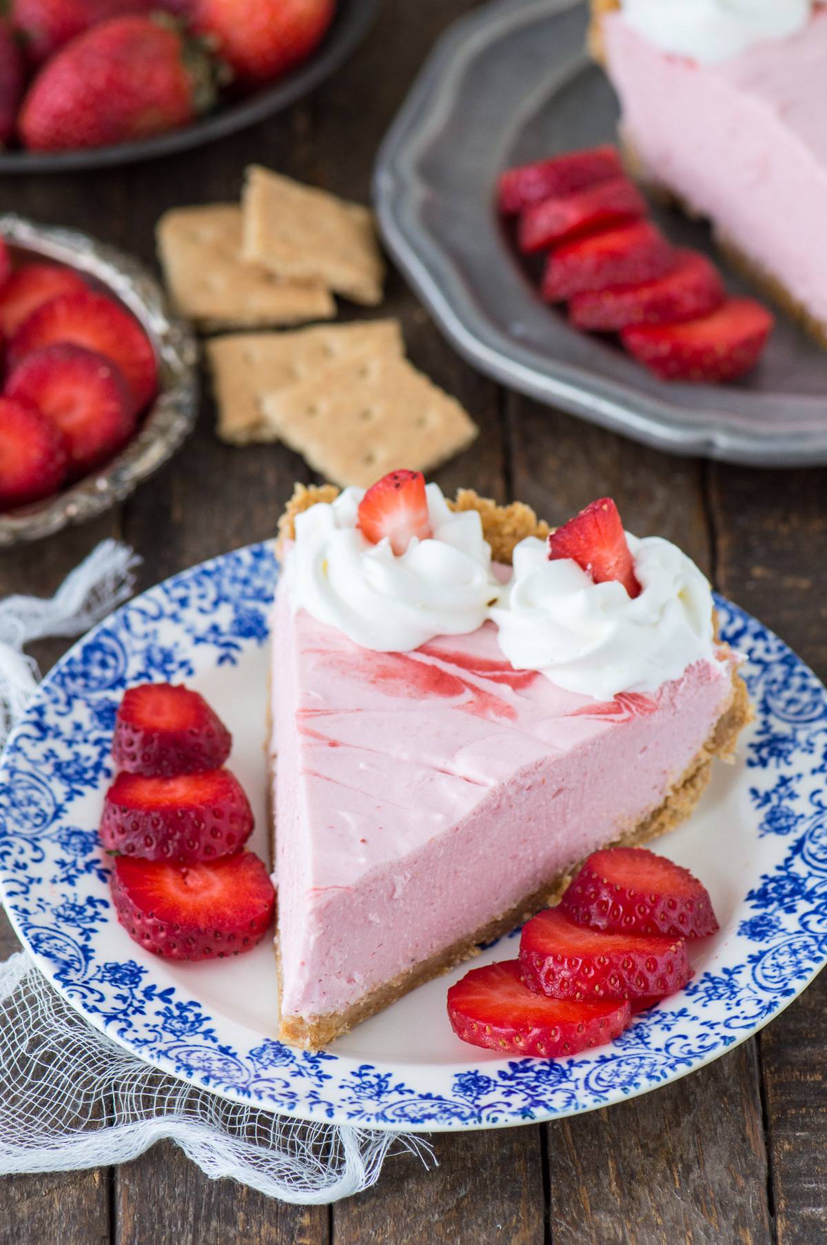 Fresh strawberry mousse pie with real strawberry puree and a homemade graham cracker crust!