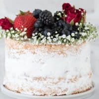 Naked berry ice cream cake recipe. A naked cake featuring 2 layers of vanilla bean cake and a layer of homemade vanilla bean berry ice cream.