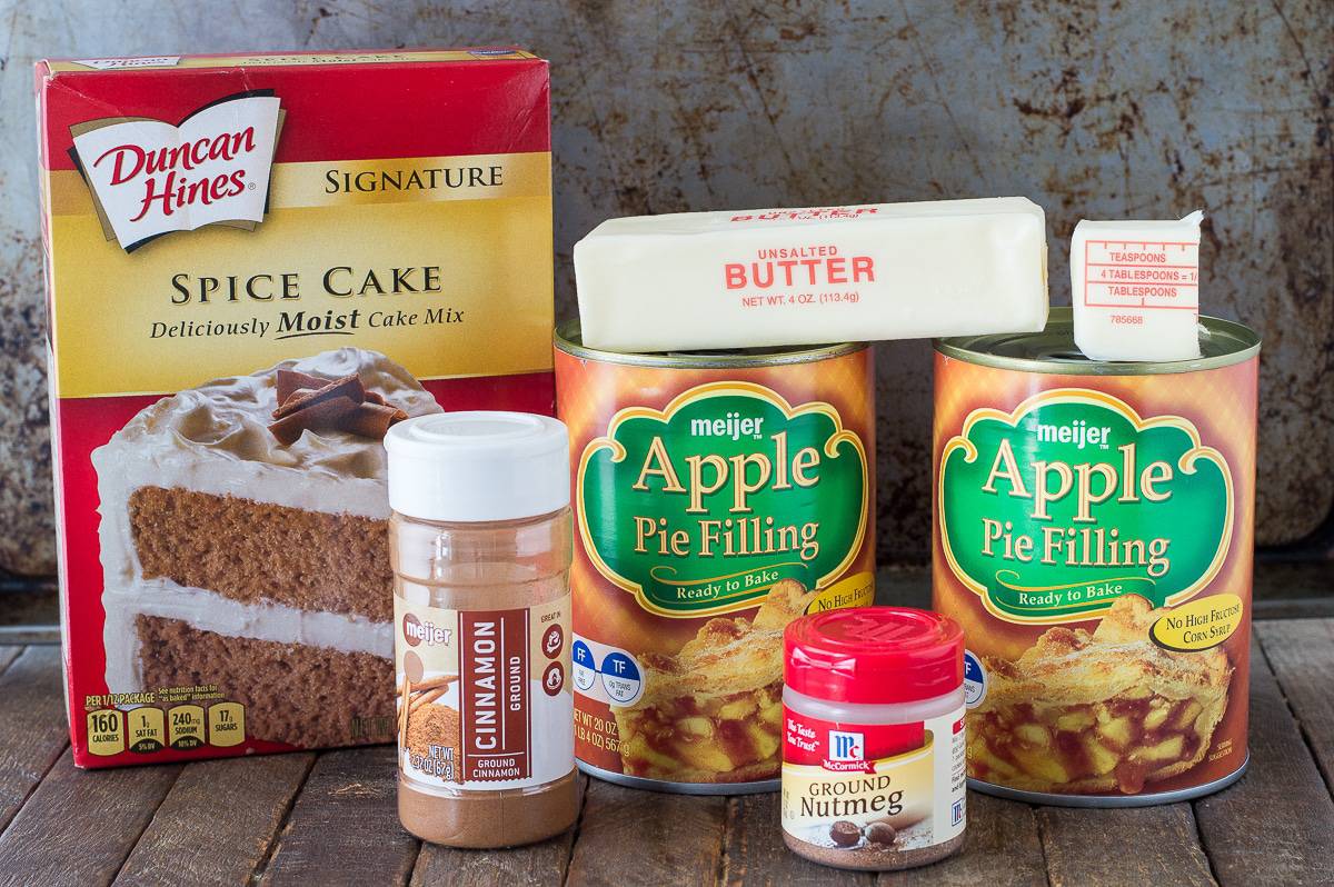 ingredients to make apple dump cake on brown background