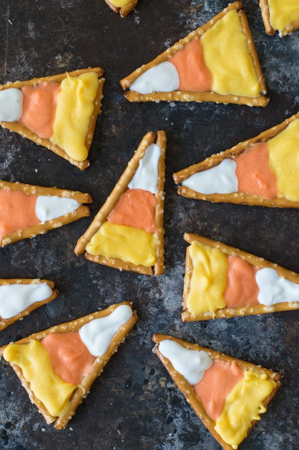 Super easy to make candy corn pretzels! This is a fun halloween treat that kids could make using pretzels and colored candy melts.