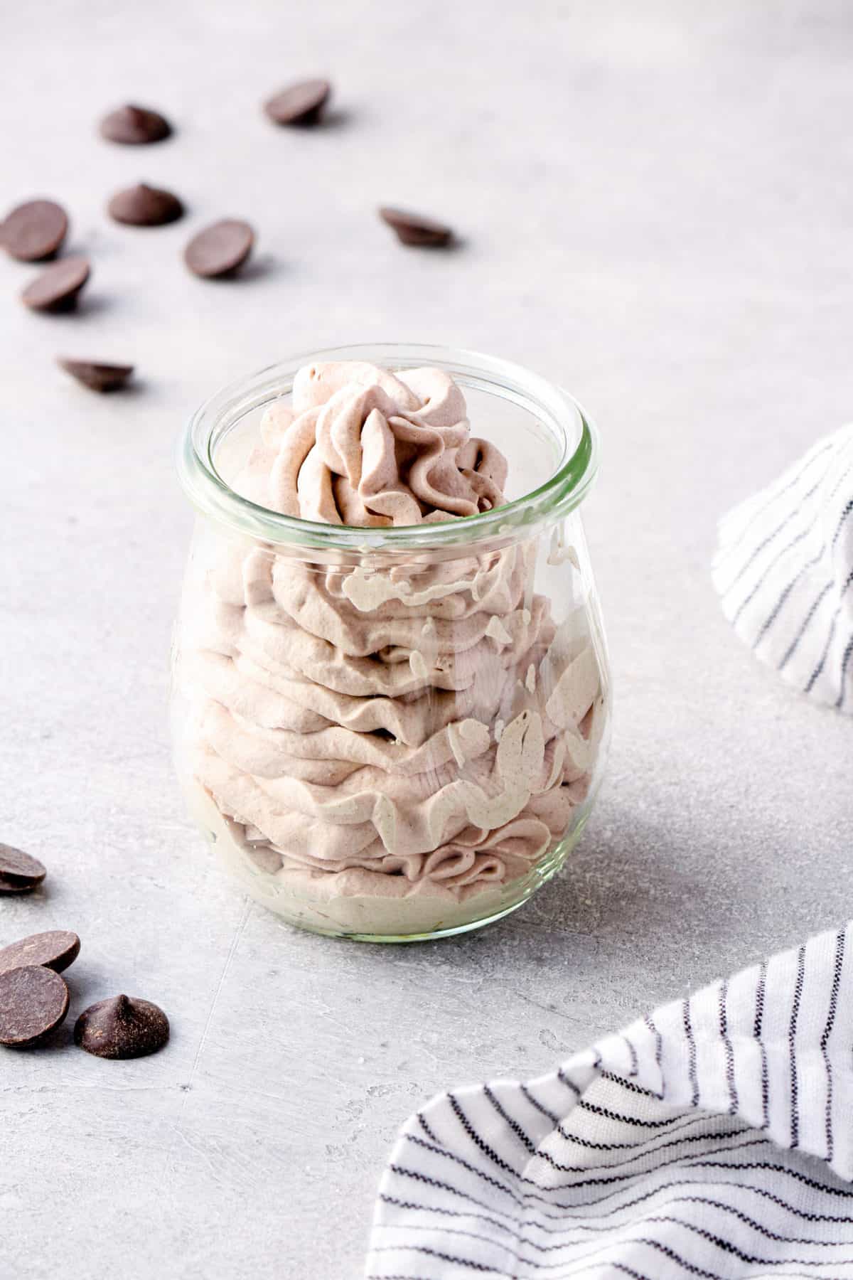 chocolate whipped cream piped into glass jar