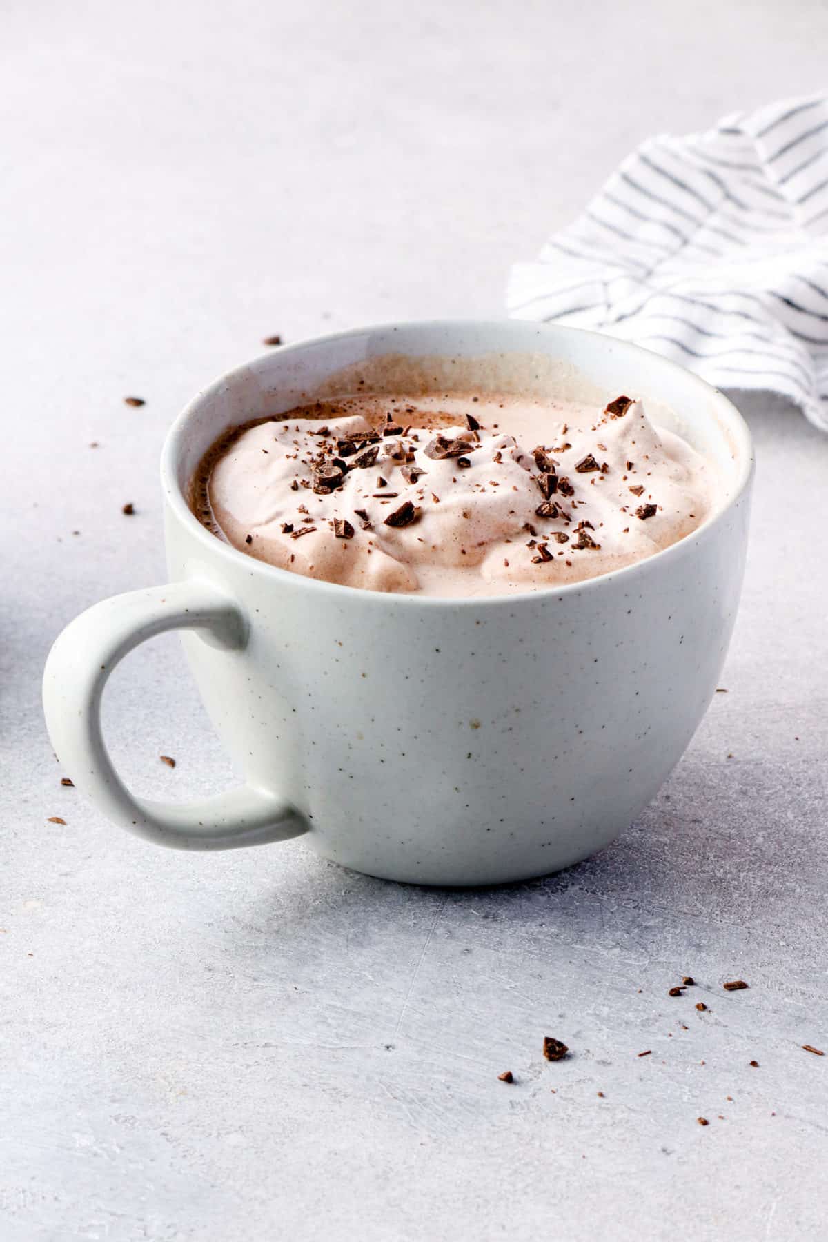 mug of hot chocolate with chocolate whipped cream on top