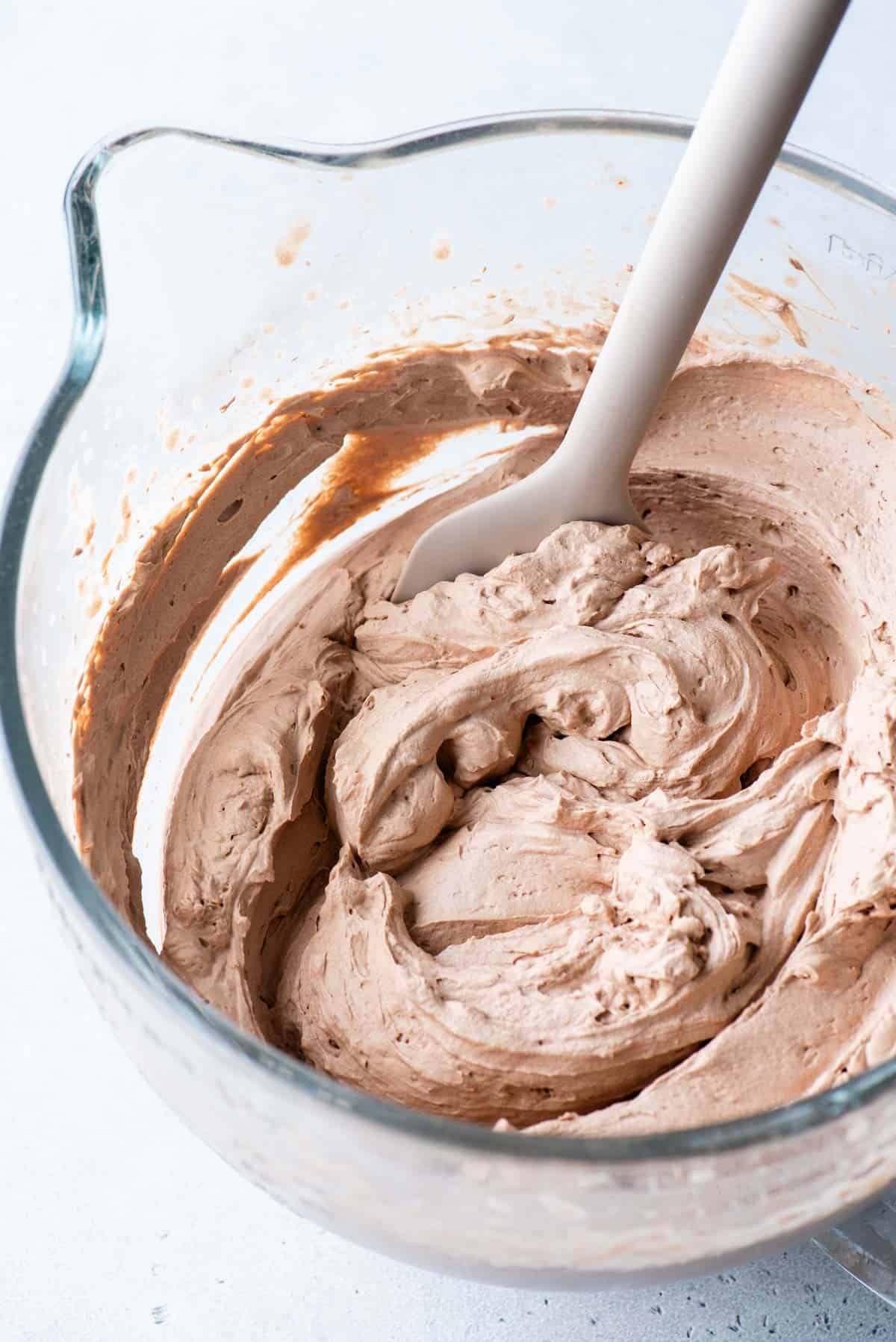 chocolate whipped cream in glass mixing bowl