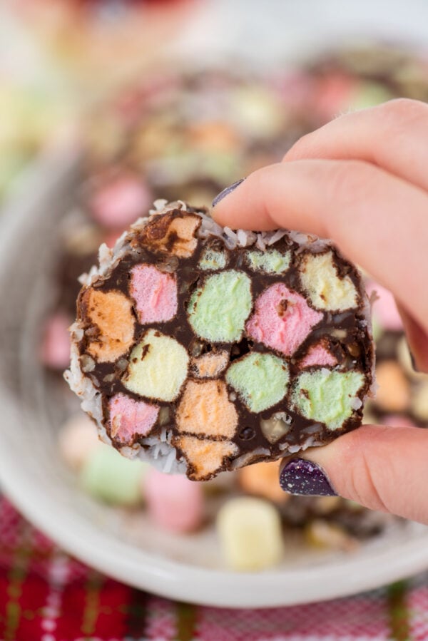 close up of no bake christmas church window cookie in a hand