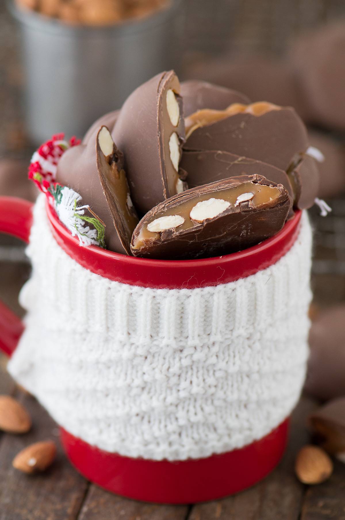 Homemade Sticky Paws in a beautiful red mug on a wooden table.