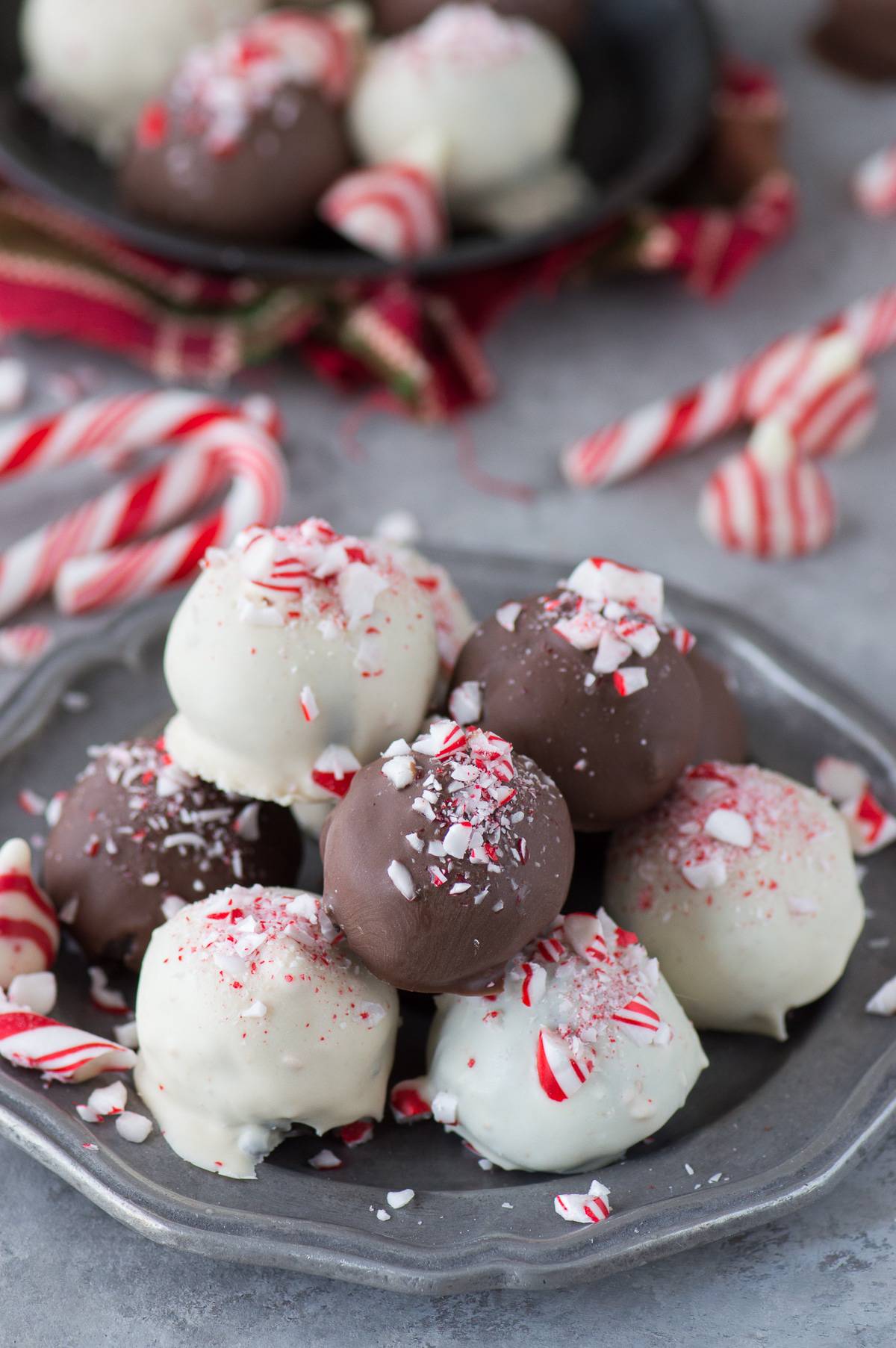 chocolate and white chocolate peppermint oreo balls on metal plate