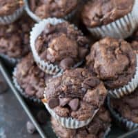 These are the BEST healthier chocolate mini muffins with no granulated sugar, butter or oil in the recipe! Make healthier chocolate muffins with bananas, greek yogurt, and honey.