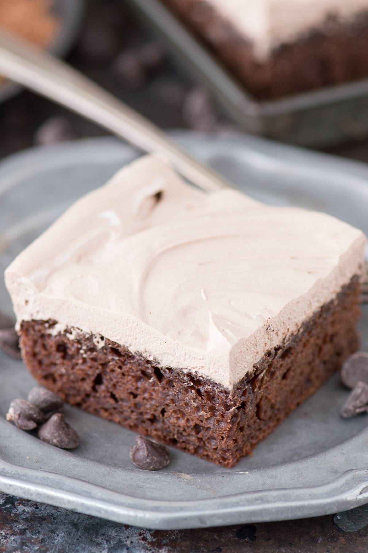 slice of healthy chocolate cake from scratch on metal plate