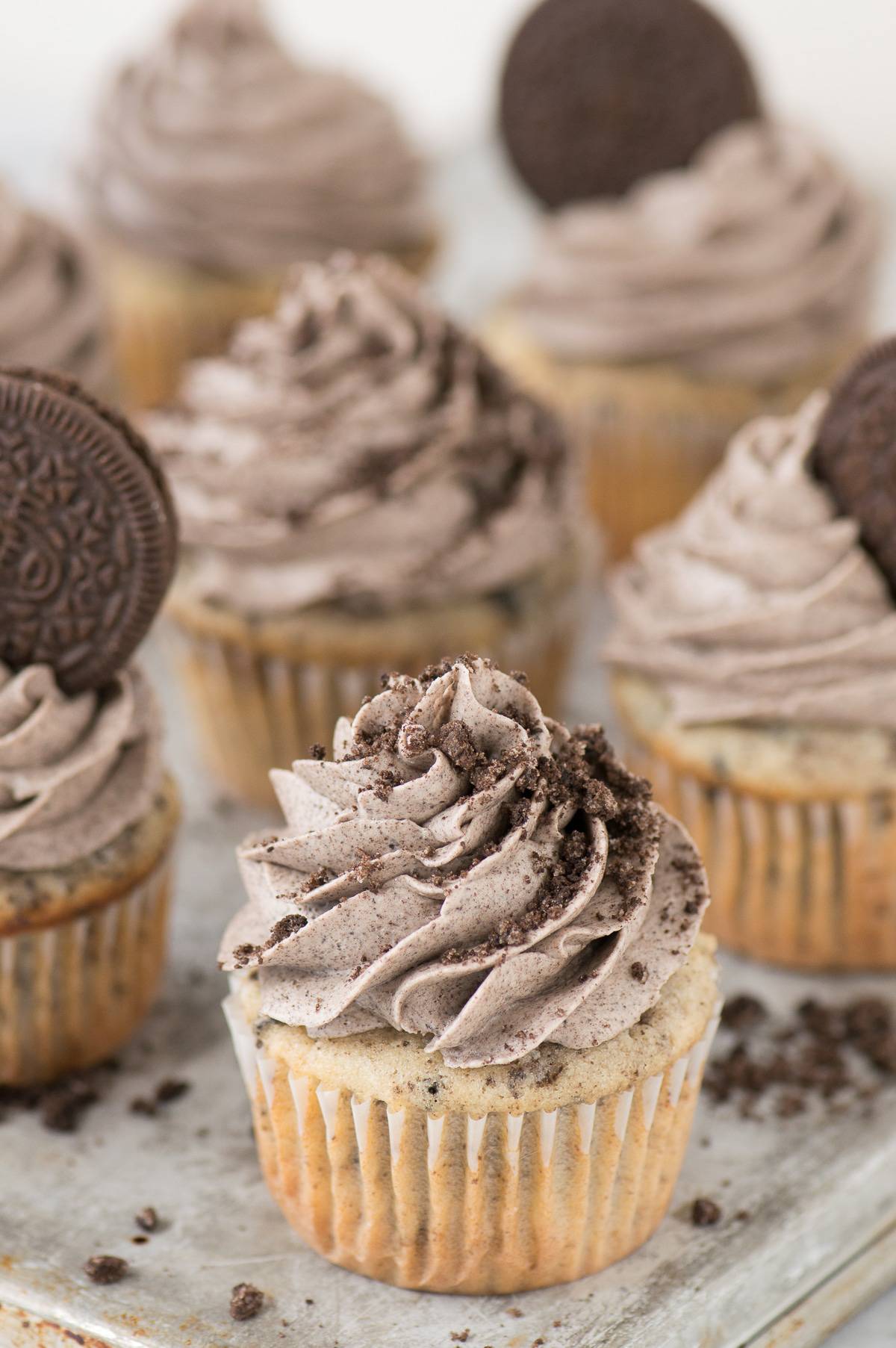 cookies and cream cupcake with oreo frosting on metal baking sheet