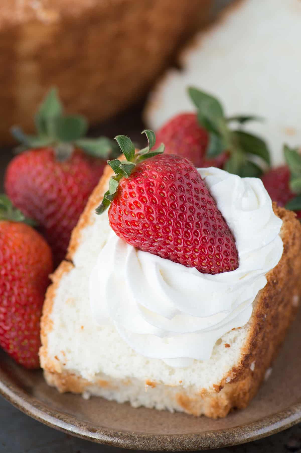 100% homemade angel food cake! This is the recipe that everyone will ask you for! This recipe shows you how to use all purpose flour instead of cake flour, and you can easily make it gluten free! 