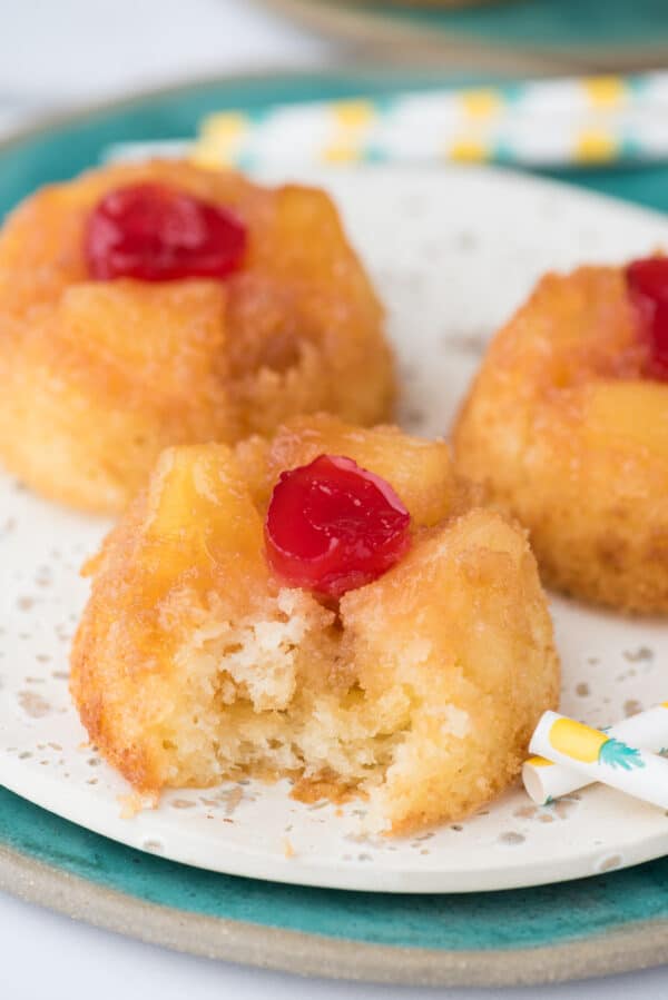mini pineapple upside down cupcakes on white plate