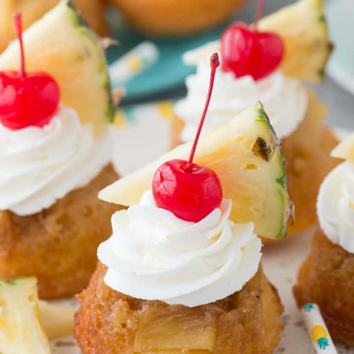 The BEST 7 ingredient mini pineapple upside down cakes! The cakes are so moist and I LOVE the presentation with the garnishes!