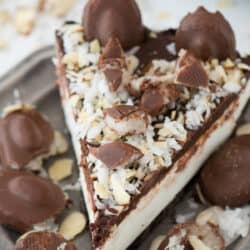 No bake almond joy pie with an oreo crust, creamy coconut filling, chocolate ganache and topped with all the components of an Almond Joy candy bar!