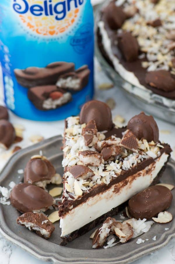 No bake almond joy pie with an oreo crust, creamy coconut filling, chocolate ganache and topped with all the components of an Almond Joy candy bar! 