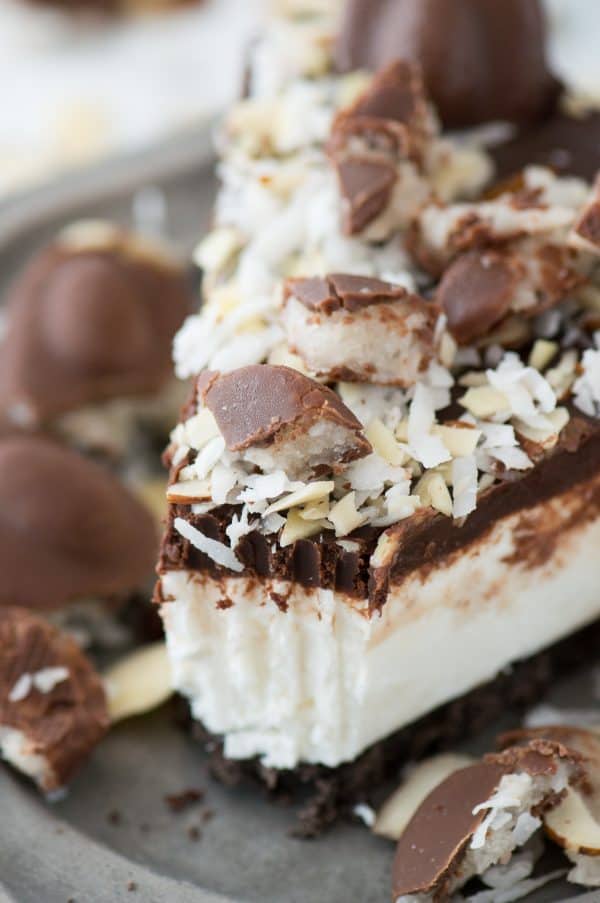 No bake almond joy pie with an oreo crust, creamy coconut filling, chocolate ganache and topped with all the components of an Almond Joy candy bar! 