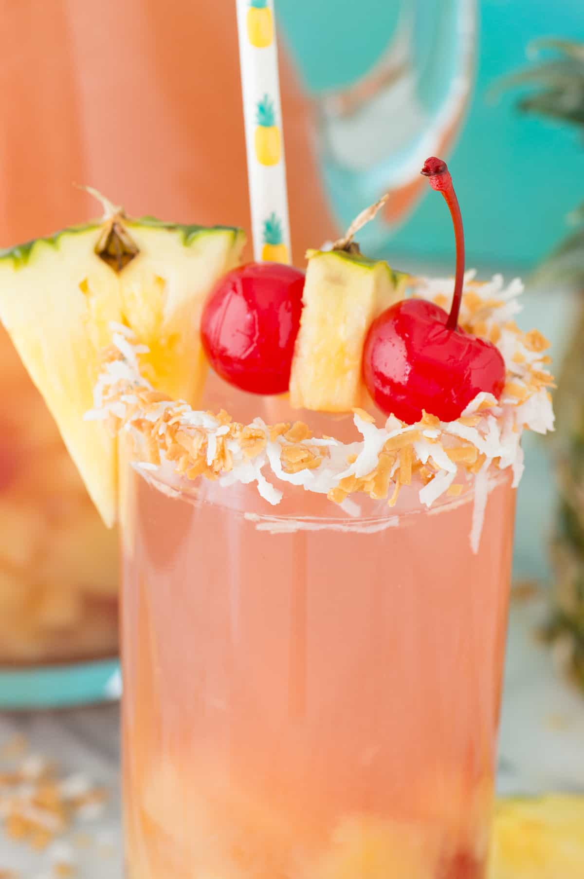 pina colada sangria in a glass cup with pineapple and cherry for garish