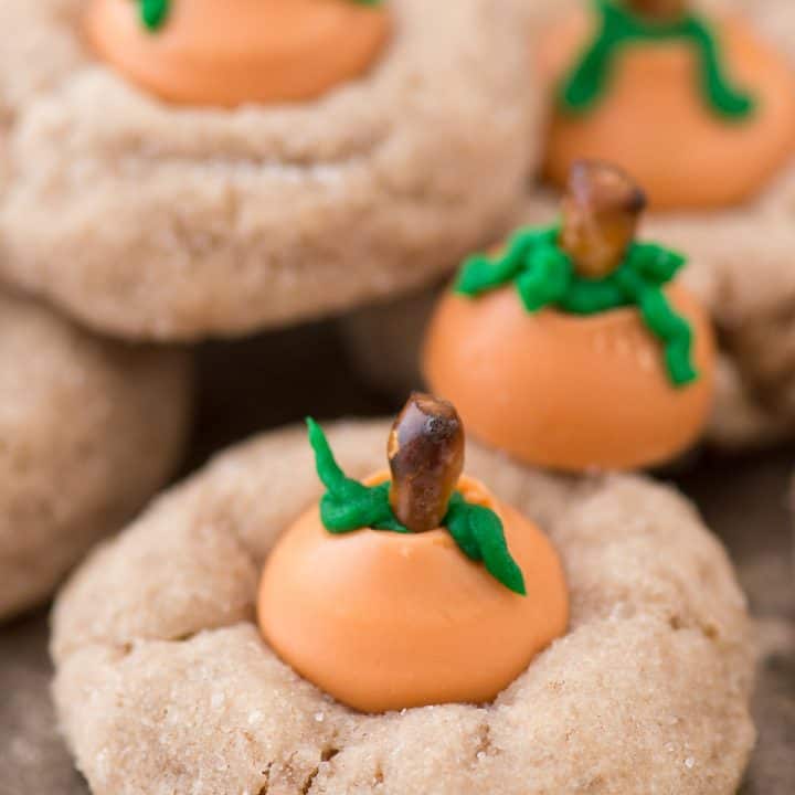 These are the most adorable fall cookies - pumpkin blossom cookies! A spice cookie with pumpkin spice hershey’s kisses turned into PUMPKINS!