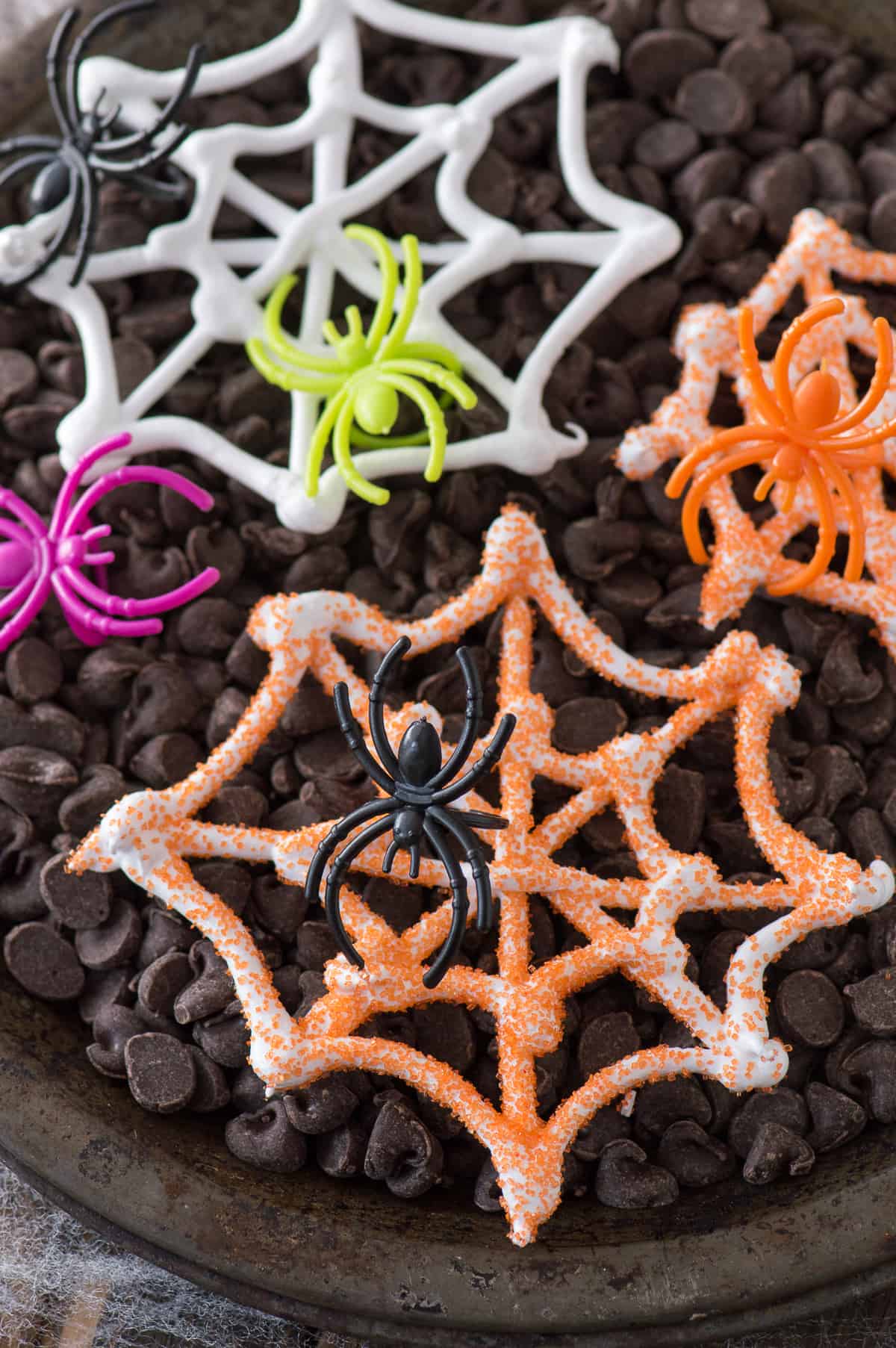 An easy Halloween treat - edible spider web meringues! Display these spider webs with plastic spider rings for a spooky look!