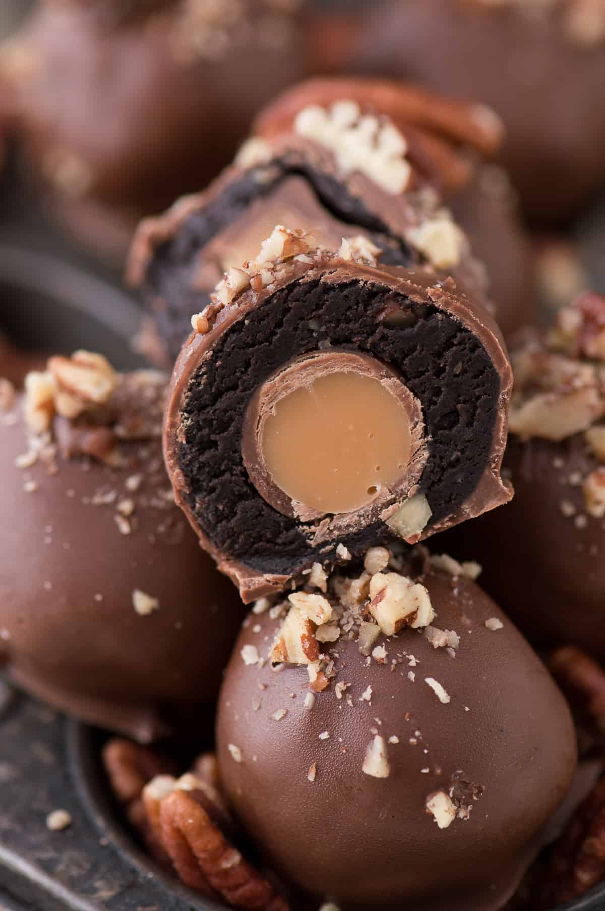The ultimate turtle oreo ball with chocolate, caramel and nuts! Each oreo ball is stuffed with a ROLO!