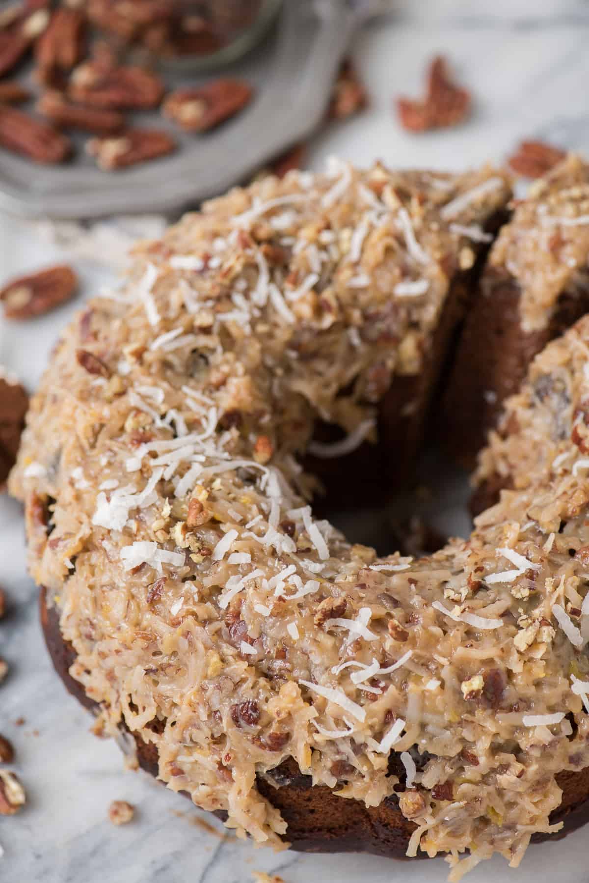 Rich and chocolatey german chocolate bundt cake with classic german chocolate frosting! We’ll show you how to make that classic coconut pecan frosting!