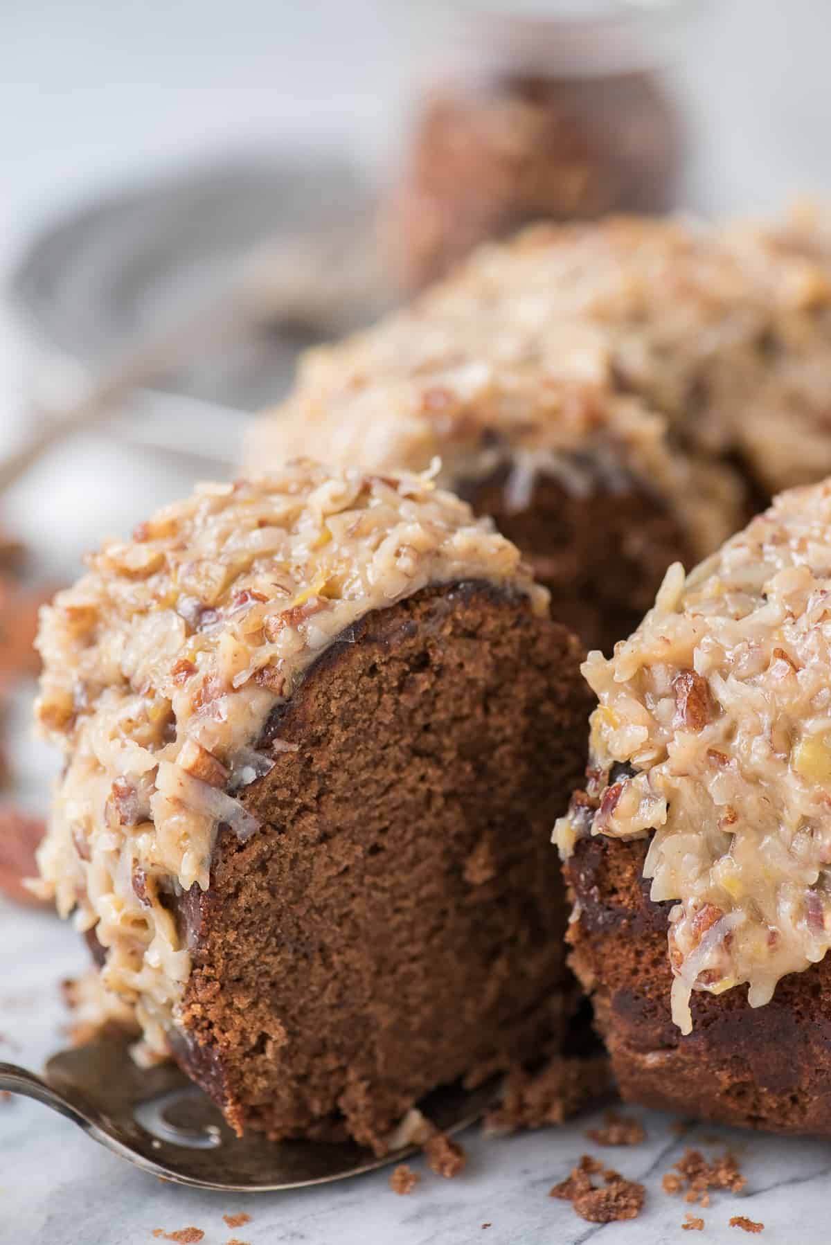 Rich and chocolatey german chocolate bundt cake with classic german chocolate frosting! We’ll show you how to make that classic coconut pecan frosting!