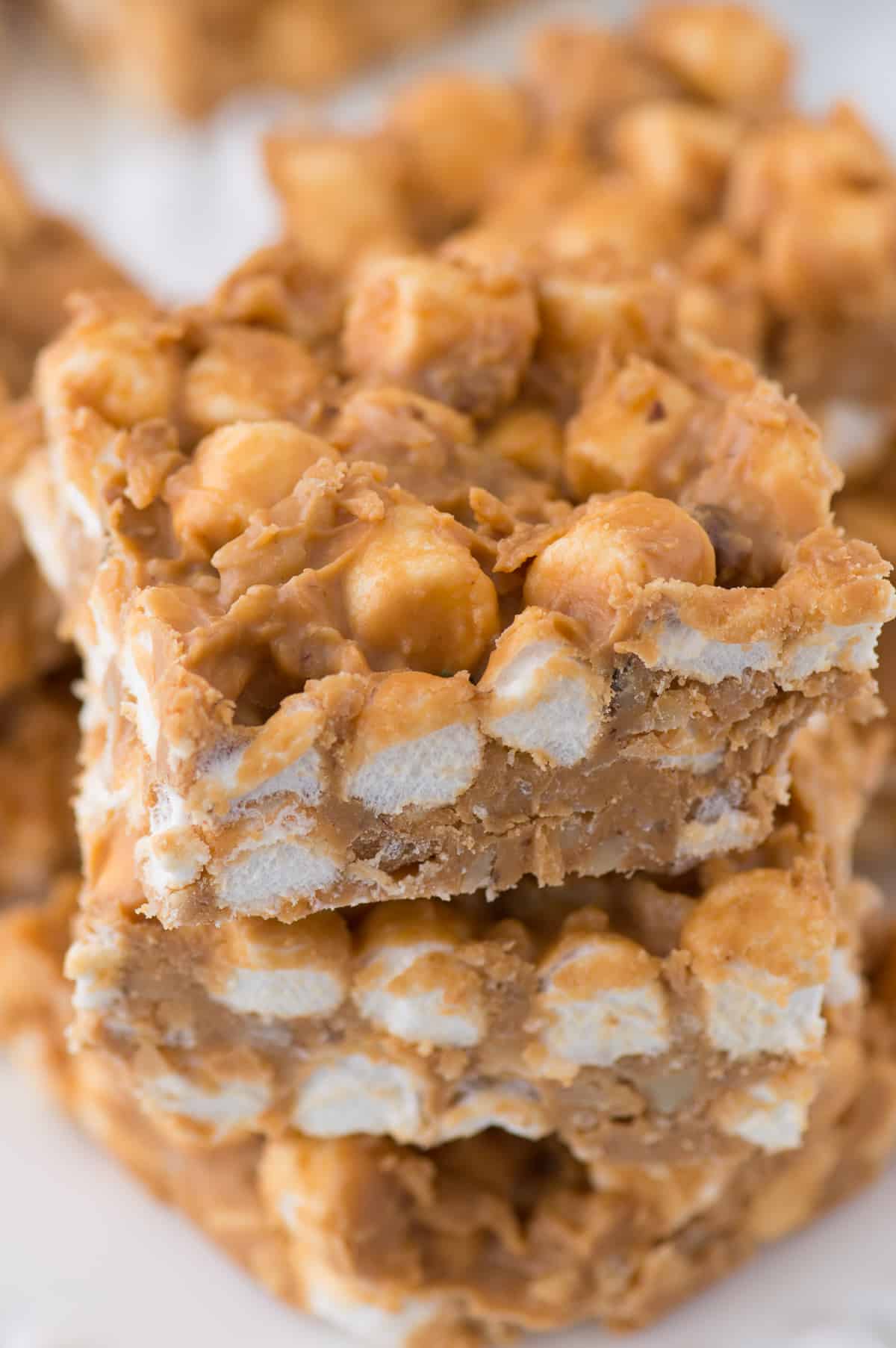 3 butterscotch marshmallow bars stacked on top of each other on white background