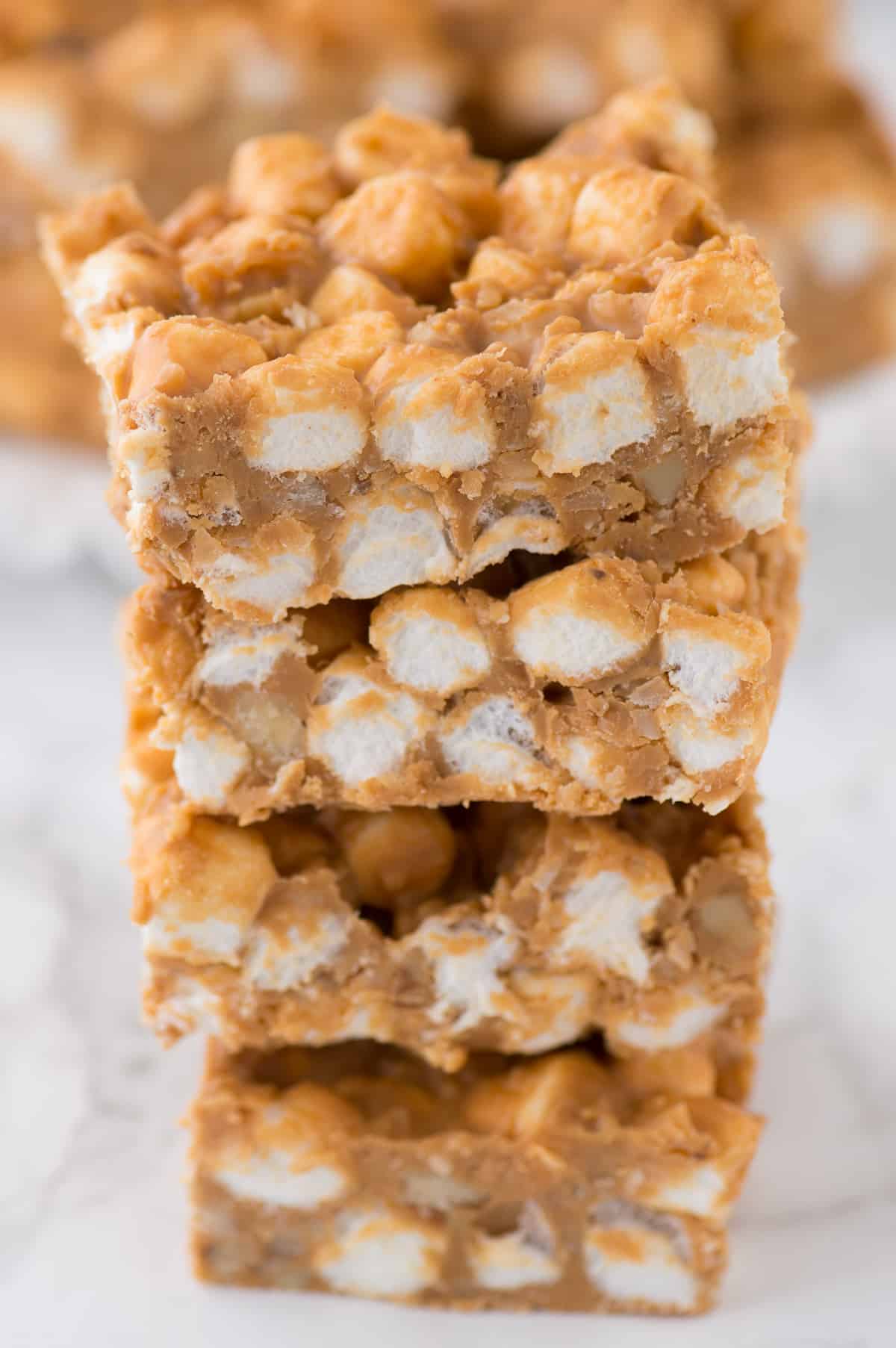 3 butterscotch marshmallow bars stacked on top of each other on white background