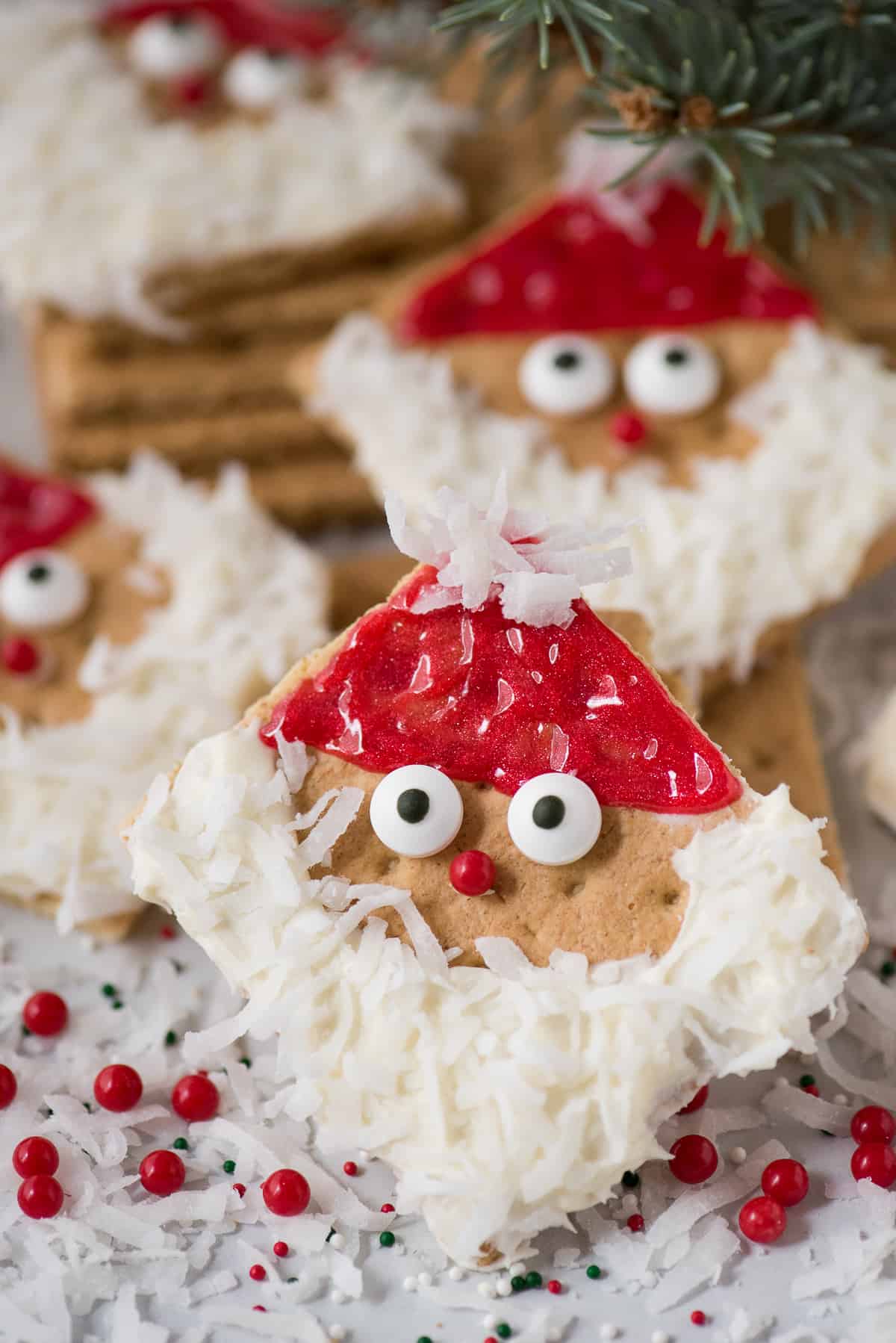 graham cracker squares decorated with frosting to look like Santa