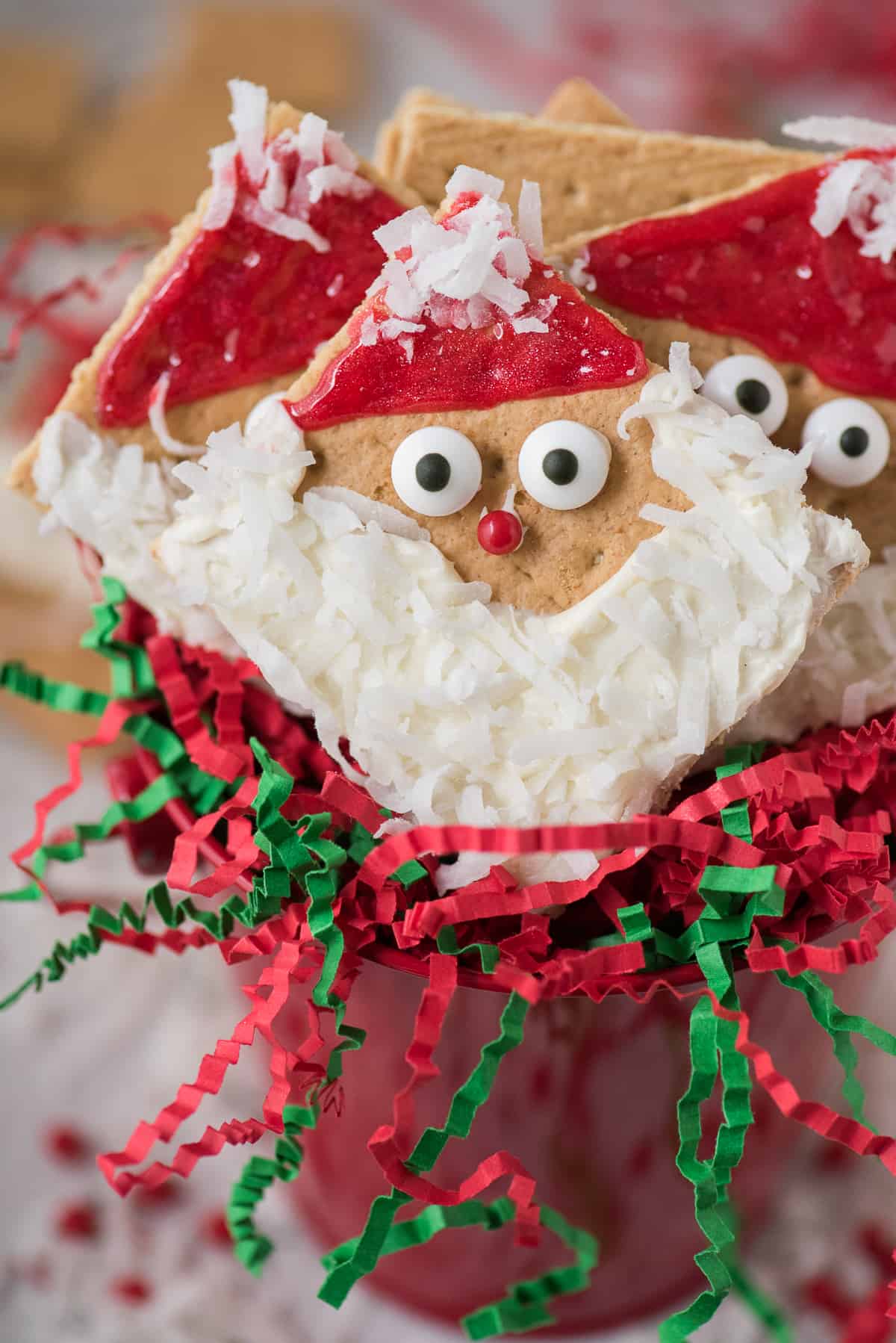 graham cracker squares decorated with frosting to look like Santa