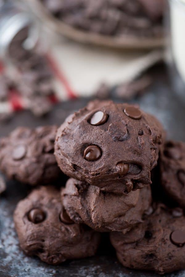 Healthier Dark Chocolate Coconut Oil Cookies - These are estimated to be 150 calories. I love that the recipe calls for ordinary ingredients, and no refined sugar, butter or oil! Stack of healthier dark chocolate coconut oil cookies.