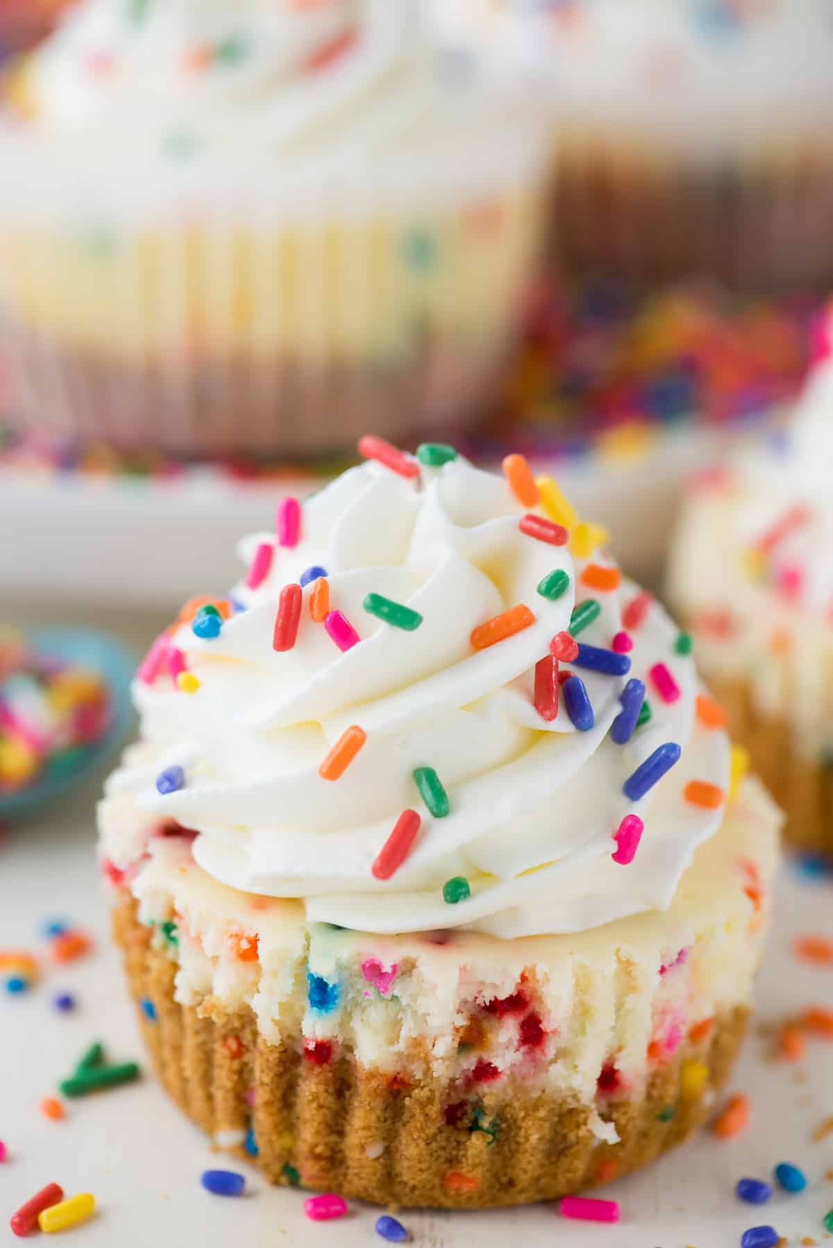 mini funfetti cheesecake with rainbow colored sprinkles on top
