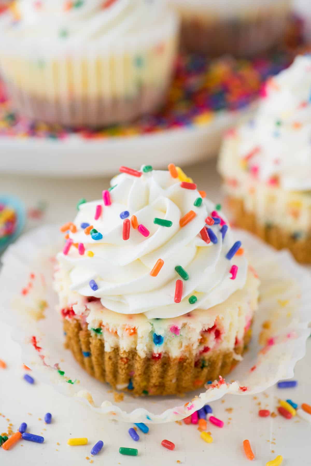mini funfetti cheesecake with rainbow colored sprinkles on top