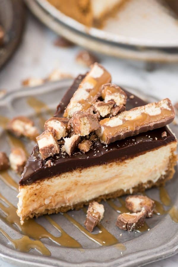 This twix cheesecake has all your favorite twix flavors - the crunchy cookie texture from the graham cracker crust, the caramel from the caramel swirled into the cheesecake, and the chocolate from the ganache topping! Then it’s topped with TWIX pieces!