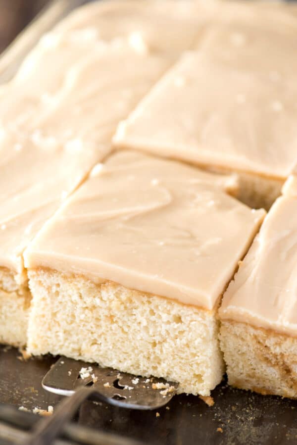 slice of caramel cake on metal spatula