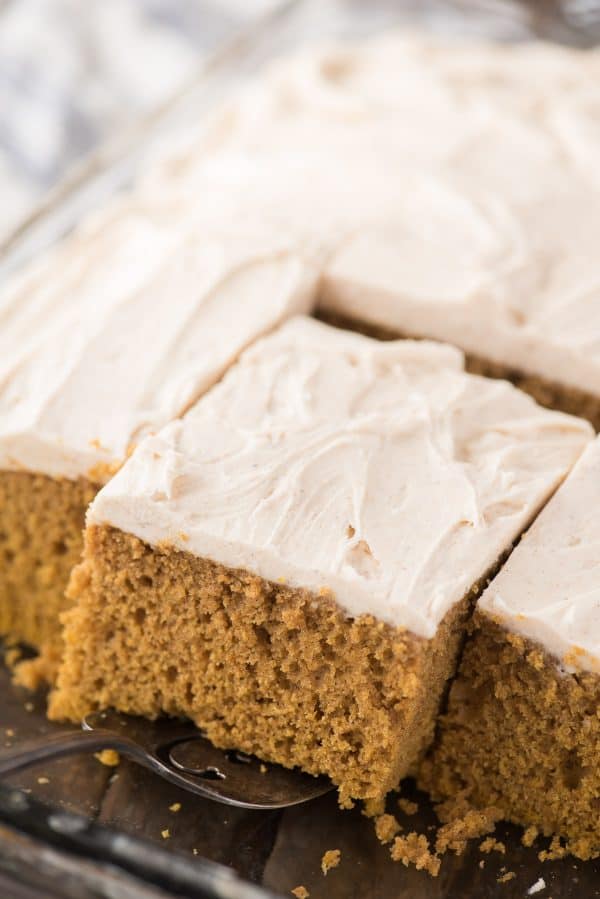 Take a spice cake mix and turn it into a doctored up pumpkin cake! With directions for how to make doctored up pumpkin cake or cupcakes, this is our family’s new favorite pumpkin cake! slice of doctored up pumpkin cake in 9 x 13 inch pan