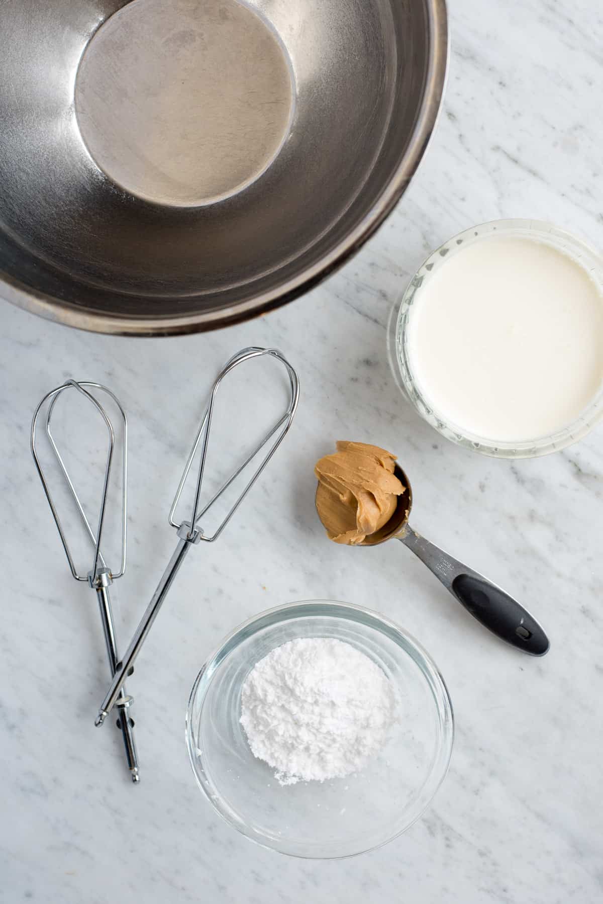 metal mixing bowl, beaters, heavy cream, peanut butter and powdered sugar