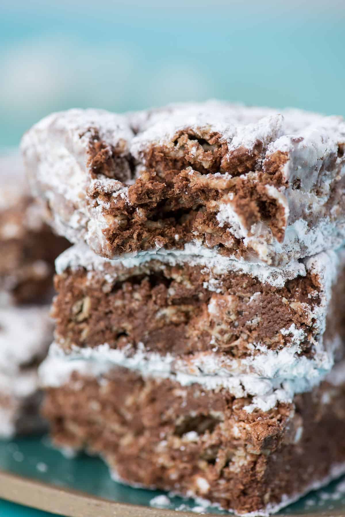 three puppy chow bars stacked on top of each other with teal background
